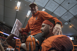 Scott Shafer is carried off the field in his last game as head coach. He finished his tenure 14-23.
